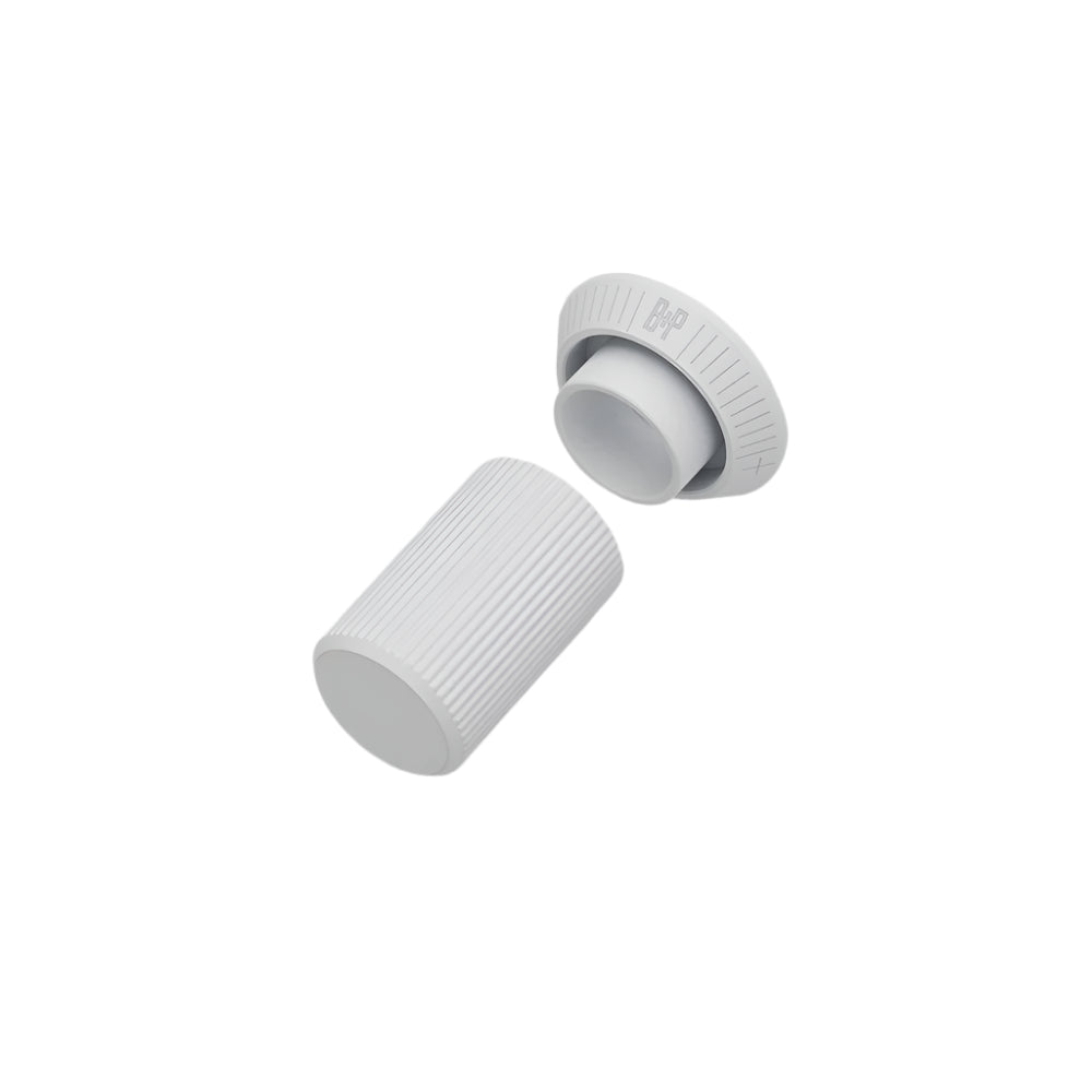 Two white cylindrical objects with ribbed texture