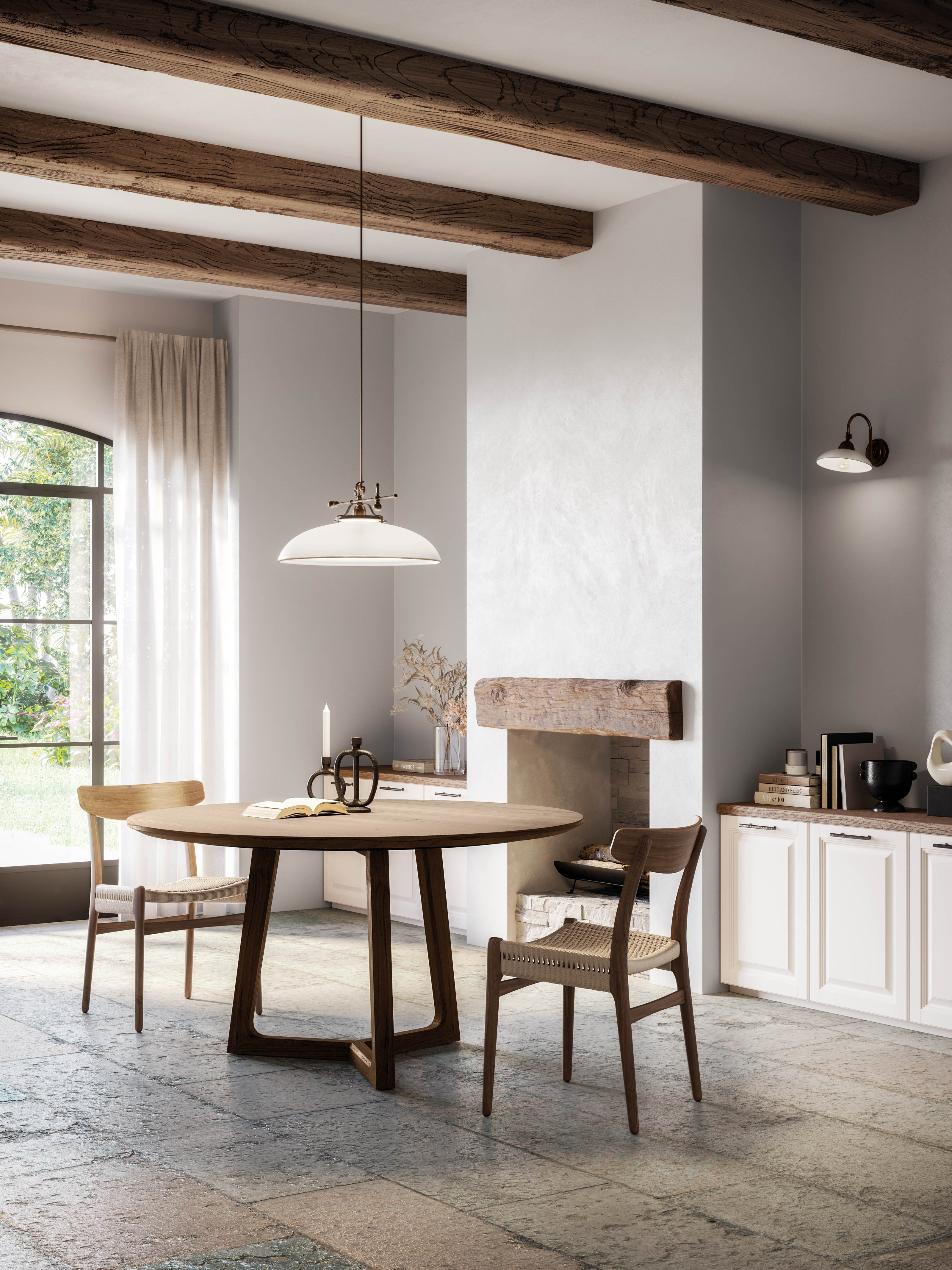 Traditional Venetian glass pendant light suspended above a round timber dining table in a rustic interior with exposed timber ceiling beams, plaster fireplace, linen curtains, and neutral cabinetry.