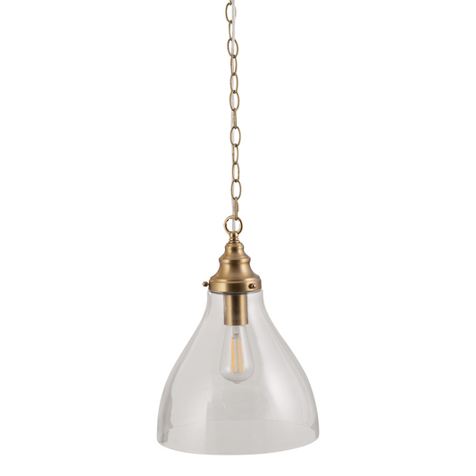 Clear glass pendant light with brass fixture on a white background